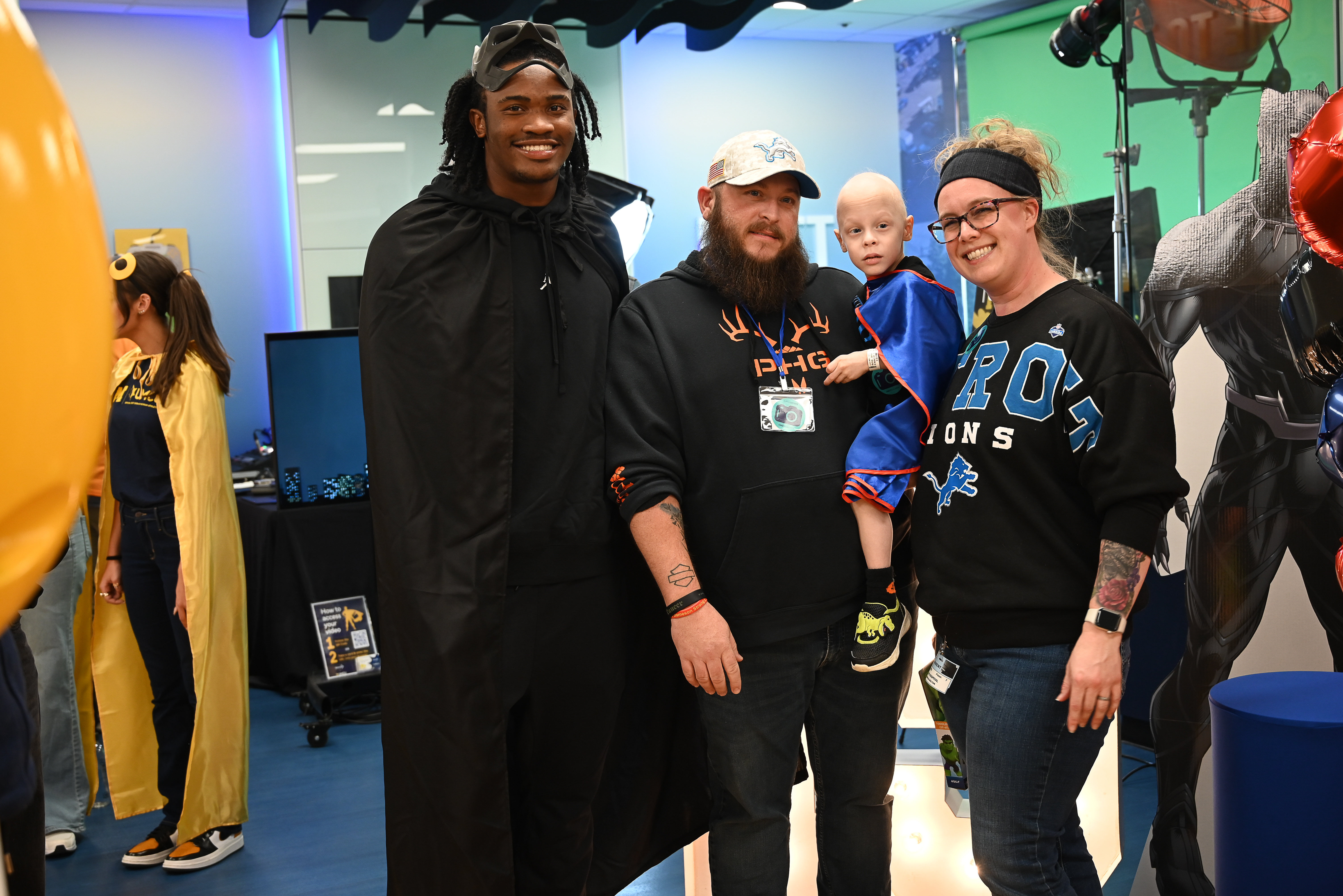 Bryce Underwood poses with a young patient and their family