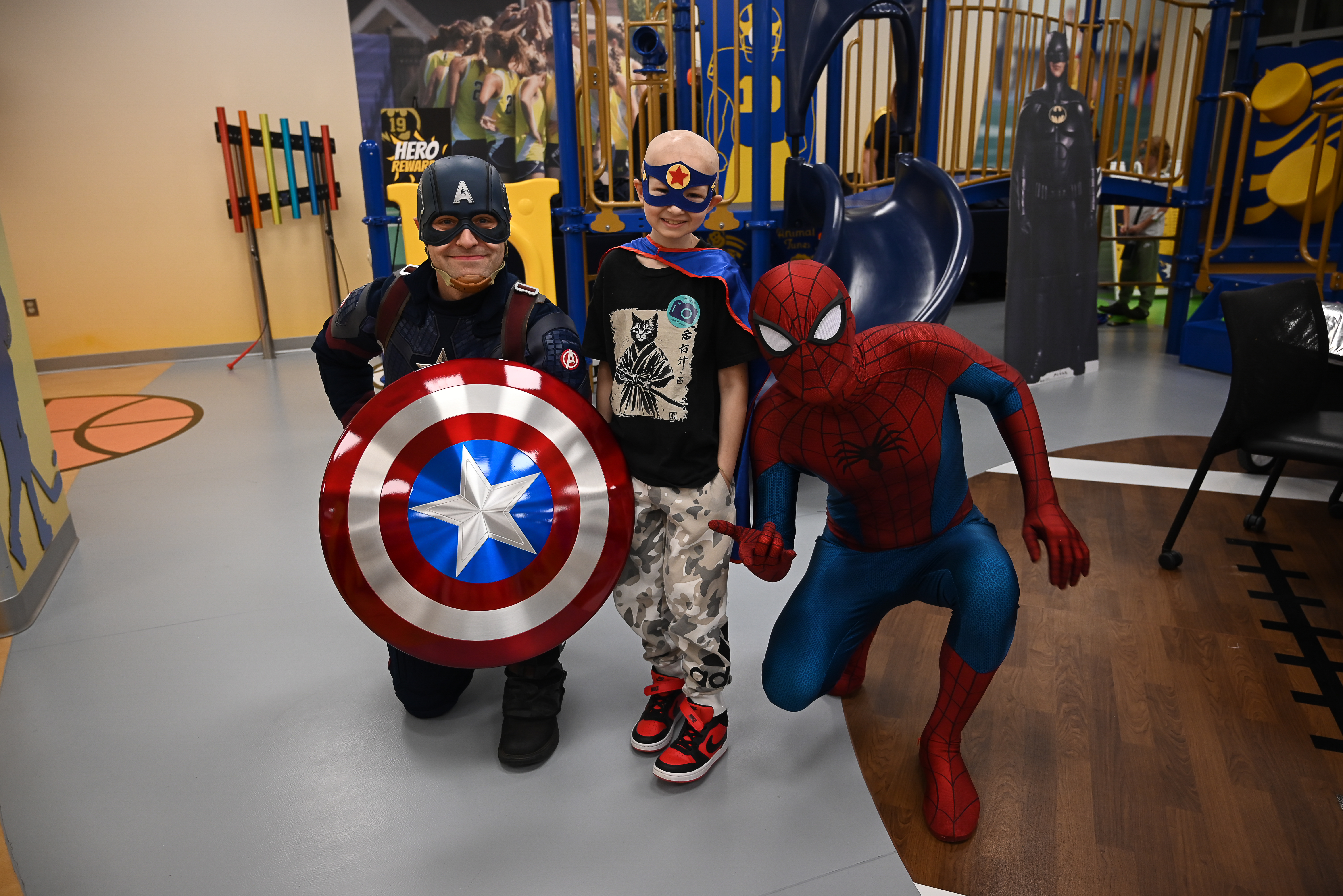 image of young patient with Captain America and Spiderman